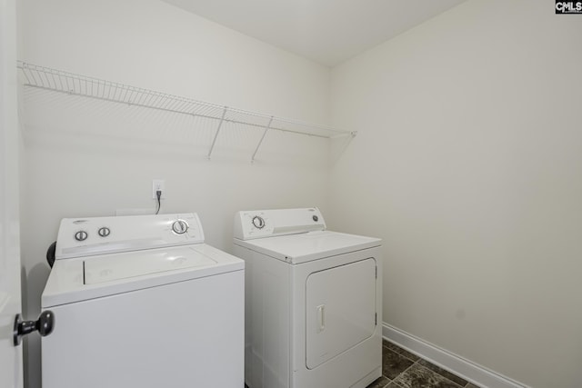 laundry room with washer and dryer, laundry area, and baseboards