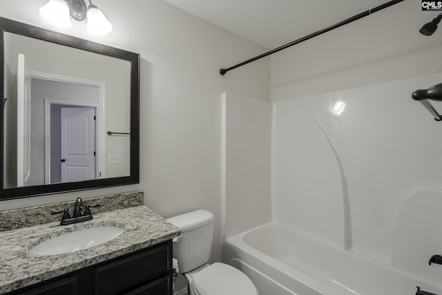 full bath with vanity, washtub / shower combination, and toilet