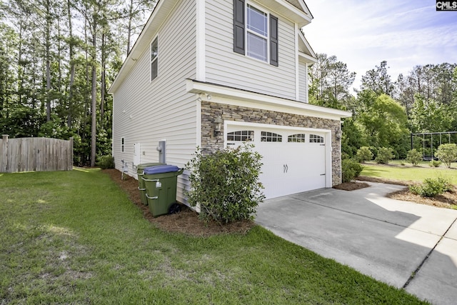 view of property exterior with fence, an attached garage, a lawn, and stone siding