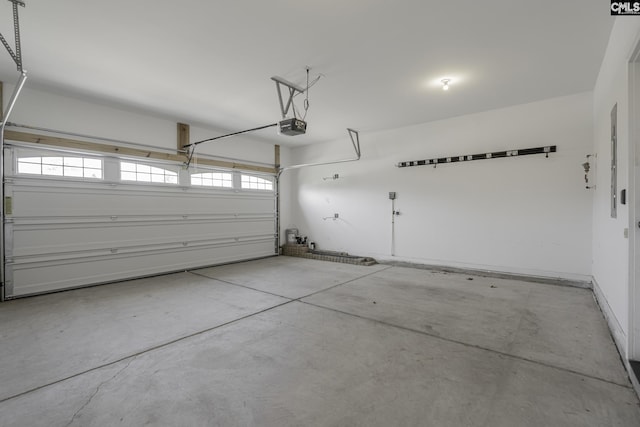 garage featuring a garage door opener