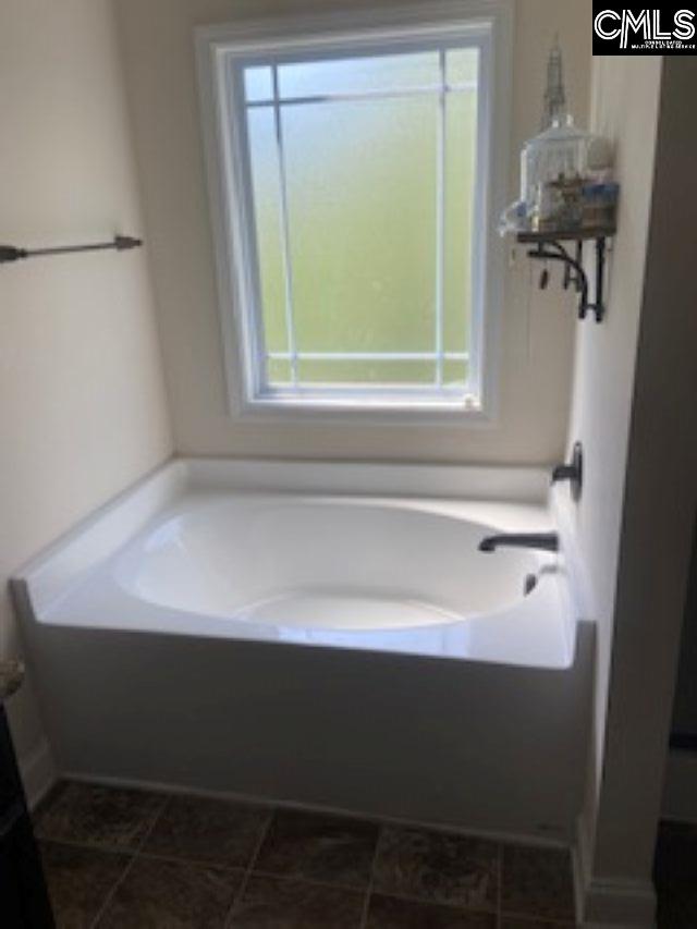 full bath featuring a bath