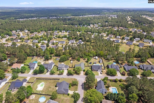 aerial view with a residential view and a wooded view