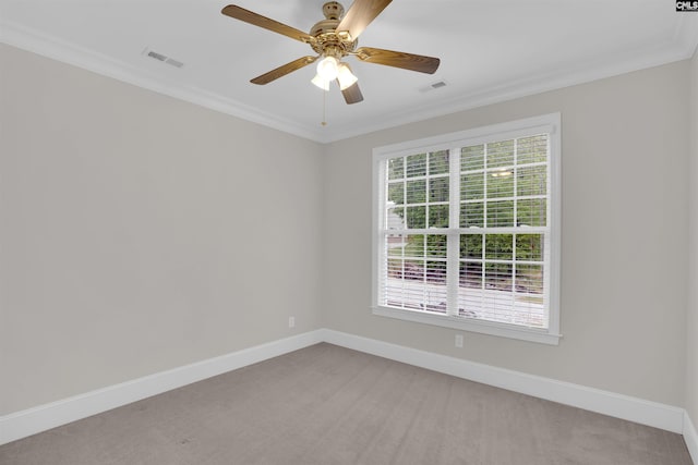 unfurnished room with crown molding, baseboards, ceiling fan, and light carpet