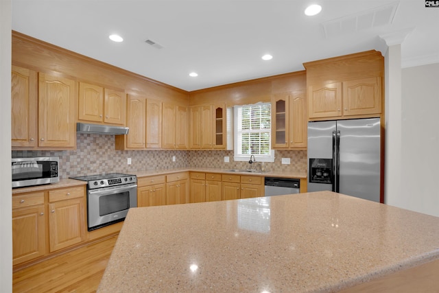 kitchen with visible vents, light brown cabinets, under cabinet range hood, a sink, and stainless steel appliances