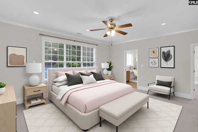 bedroom with baseboards, recessed lighting, connected bathroom, and multiple windows
