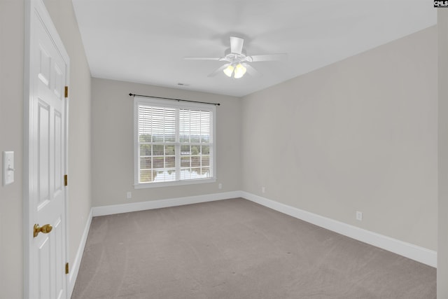 interior space featuring baseboards, carpet, and a ceiling fan