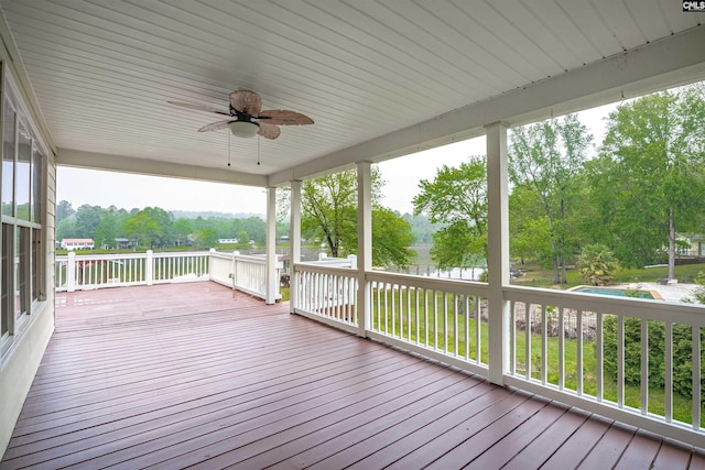 wooden terrace featuring ceiling fan