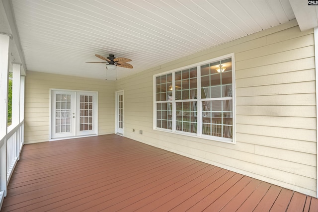 wooden deck featuring a ceiling fan