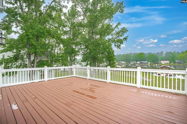 wooden deck with a water view