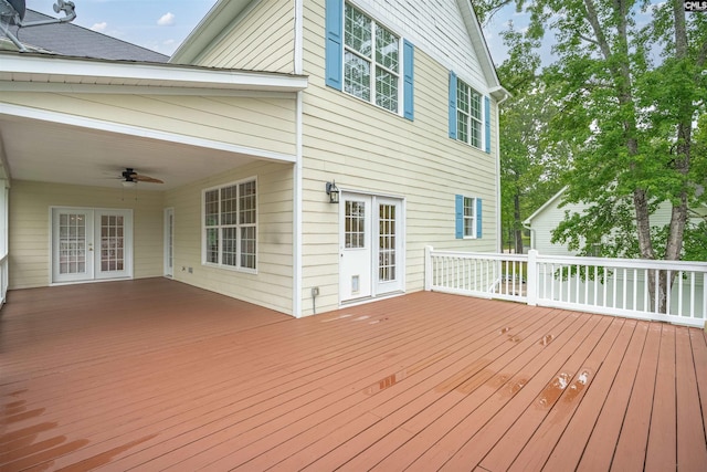 wooden terrace with french doors and a ceiling fan