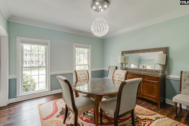 dining room featuring ornamental molding, dark wood-style floors, and a healthy amount of sunlight