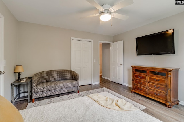 sitting room featuring baseboards, ceiling fan, and wood finished floors