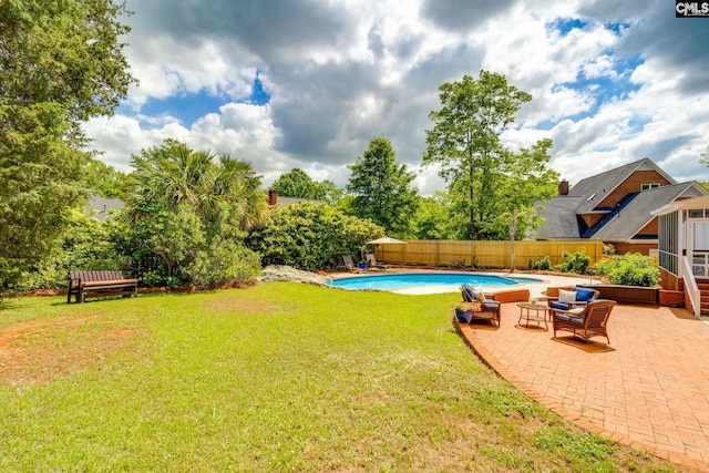 view of yard featuring a fenced in pool, a fenced backyard, and a patio area