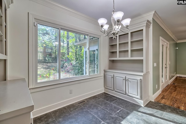 unfurnished dining area featuring an inviting chandelier, baseboards, ornamental molding, and visible vents