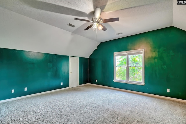 bonus room featuring visible vents, ceiling fan, and vaulted ceiling