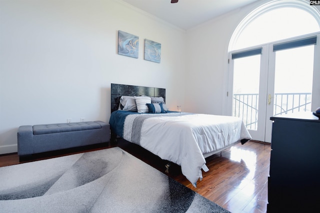 bedroom featuring access to outside, a ceiling fan, ornamental molding, and wood finished floors