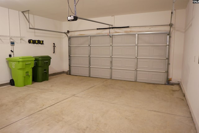 509 Malachite Ln, Chapin, SC 29036 - garage featuring baseboards and a garage door opener