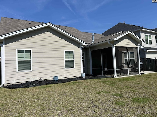 509 Malachite Ln, Chapin, SC 29036 - back of property featuring a lawn, roof with shingles, fence, and a sunroom