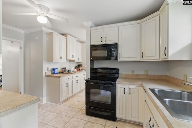 kitchen with light countertops, crown molding, a sink, and black appliances