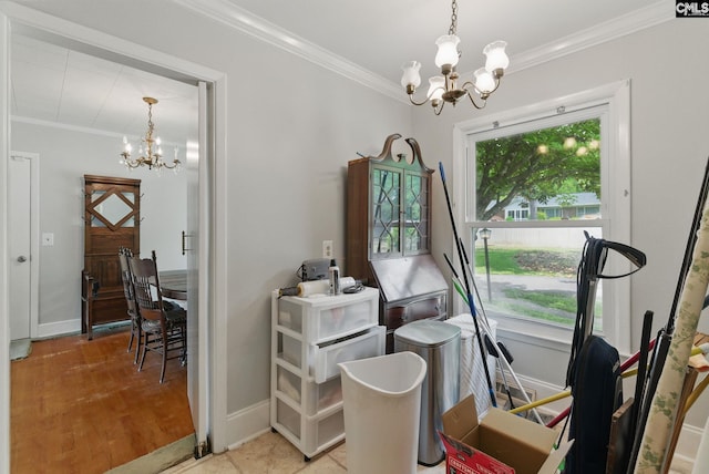 dining room featuring baseboards, a notable chandelier, and ornamental molding