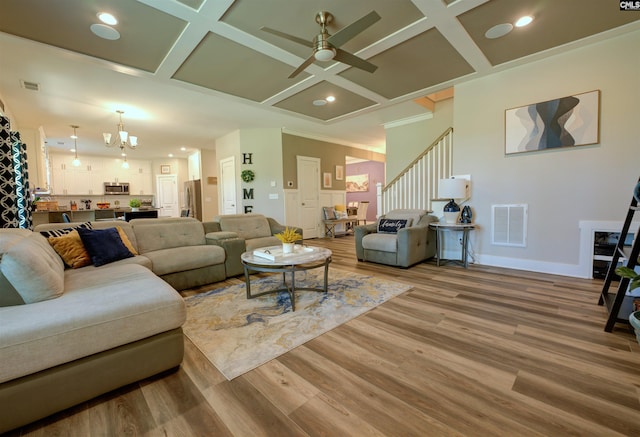 309 Creek Ridge Loop, Blythewood, SC 29016 - living area featuring baseboards, visible vents, ceiling fan with notable chandelier, and coffered ceiling