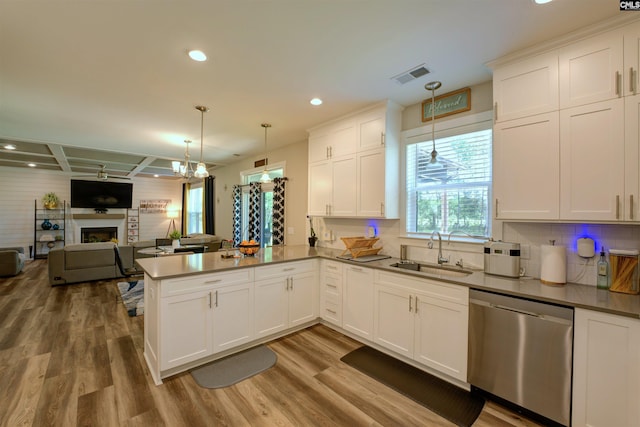 309 Creek Ridge Loop, Blythewood, SC 29016 - kitchen with a sink, dishwasher, a peninsula, open floor plan, and visible vents