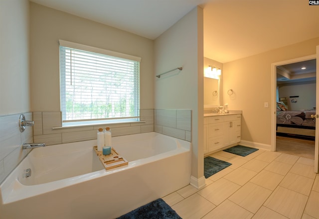 309 Creek Ridge Loop, Blythewood, SC 29016 - ensuite bathroom featuring vanity, ensuite bath, tile patterned floors, baseboards, and a garden tub