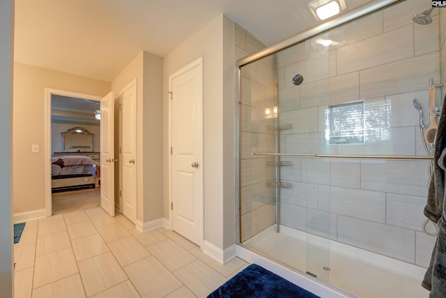 309 Creek Ridge Loop, Blythewood, SC 29016 - bathroom featuring baseboards, ensuite bath, tile patterned floors, and a stall shower
