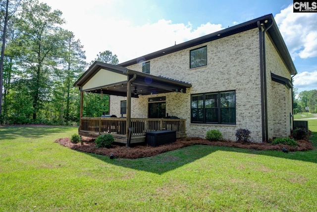 309 Creek Ridge Loop, Blythewood, SC 29016 - back of house featuring a lawn, brick siding, ceiling fan, and a wooden deck