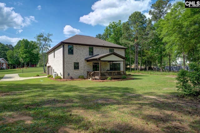 309 Creek Ridge Loop, Blythewood, SC 29016 - rear view of property featuring brick siding, a wooden deck, and a yard