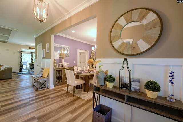 309 Creek Ridge Loop, Blythewood, SC 29016 - dining space featuring crown molding, light wood finished floors, and a notable chandelier