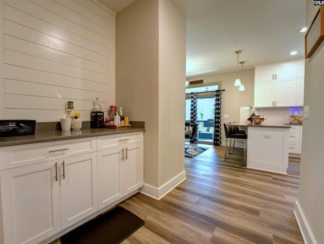309 Creek Ridge Loop, Blythewood, SC 29016 - bar with decorative light fixtures, a dry bar, baseboards, recessed lighting, and light wood-style flooring