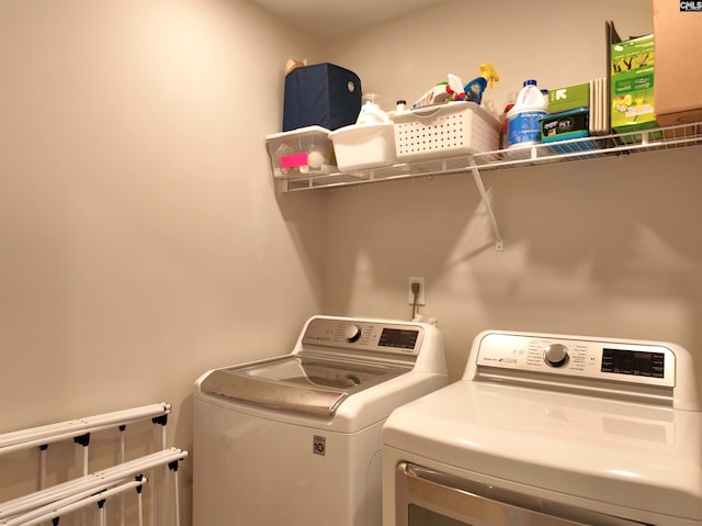 433 Outer Banks Dr, Lexington, SC 29072 - laundry room with washing machine and clothes dryer and cabinet space