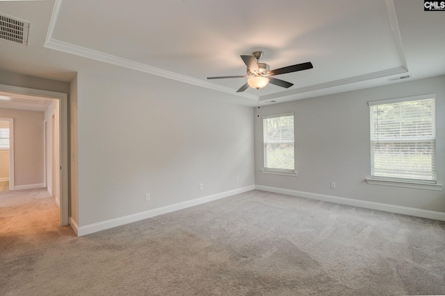 433 Outer Banks Dr, Lexington, SC 29072 - unfurnished room featuring light colored carpet, a ceiling fan, baseboards, ornamental molding, and a raised ceiling