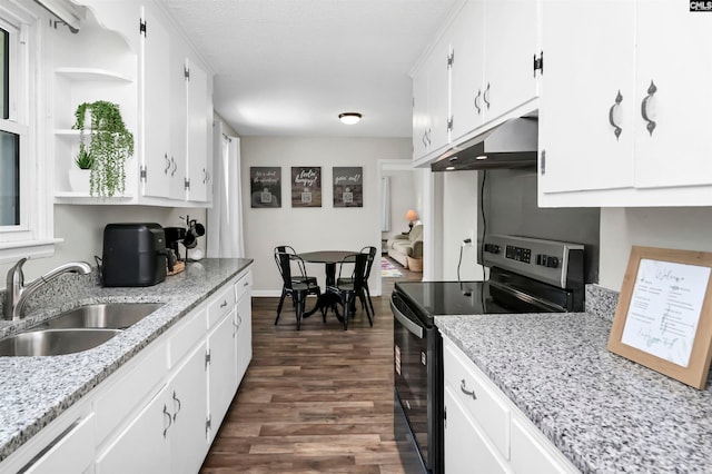 kitchen with open shelves, stainless steel electric range, a sink, under cabinet range hood, and white cabinetry