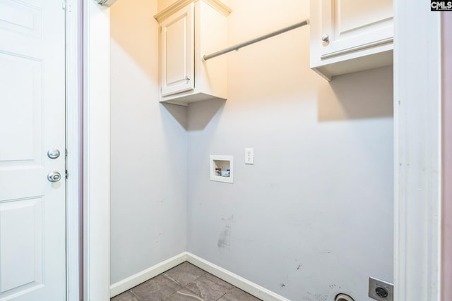 laundry room featuring baseboards, hookup for a washing machine, electric dryer hookup, cabinet space, and light tile patterned floors