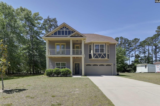view of front of house featuring a garage, a balcony, a front yard, and concrete driveway