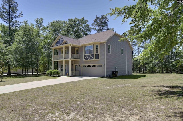 view of front facade featuring a garage, concrete driveway, a front yard, and a balcony