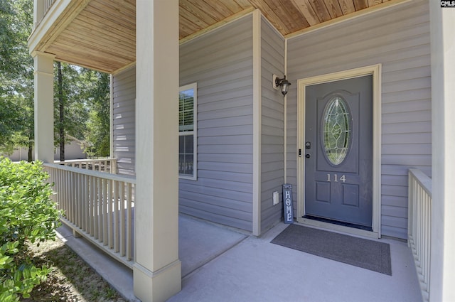 doorway to property with a porch