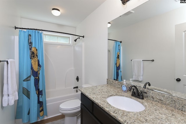 bathroom with vanity, toilet, and shower / tub combo with curtain