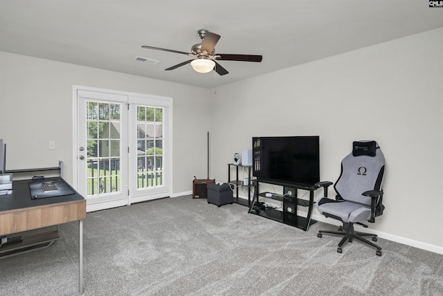 home office featuring ceiling fan, visible vents, baseboards, and carpet
