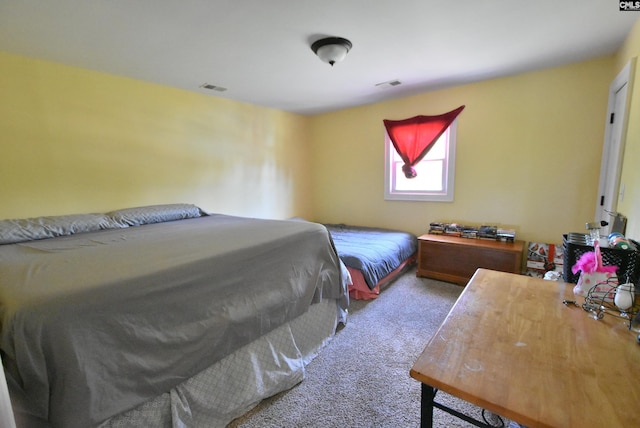 carpeted bedroom with visible vents