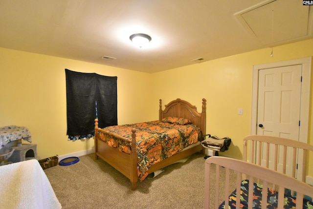 bedroom featuring carpet flooring, baseboards, visible vents, and attic access