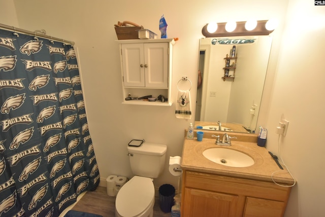 bathroom with vanity, a shower with curtain, and toilet