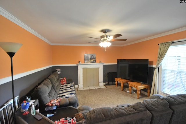living area with carpet floors, a ceiling fan, and crown molding