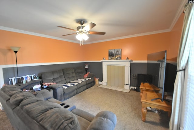 carpeted living area with a ceiling fan and ornamental molding