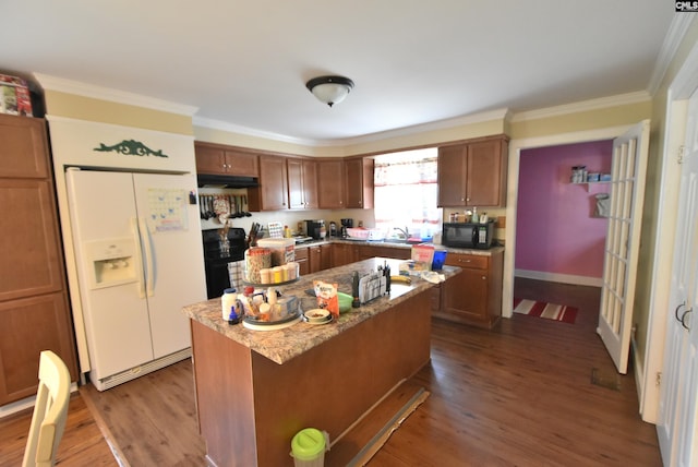 kitchen with ornamental molding, black microwave, white refrigerator with ice dispenser, dark wood-style floors, and under cabinet range hood