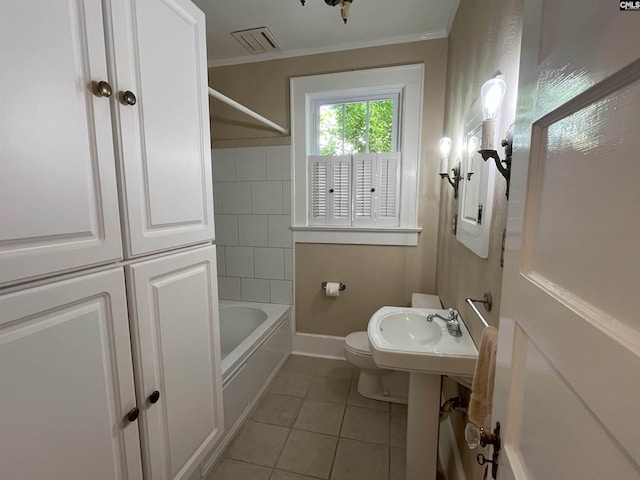 bathroom featuring ornamental molding, a sink, toilet, tile patterned floors, and  shower combination