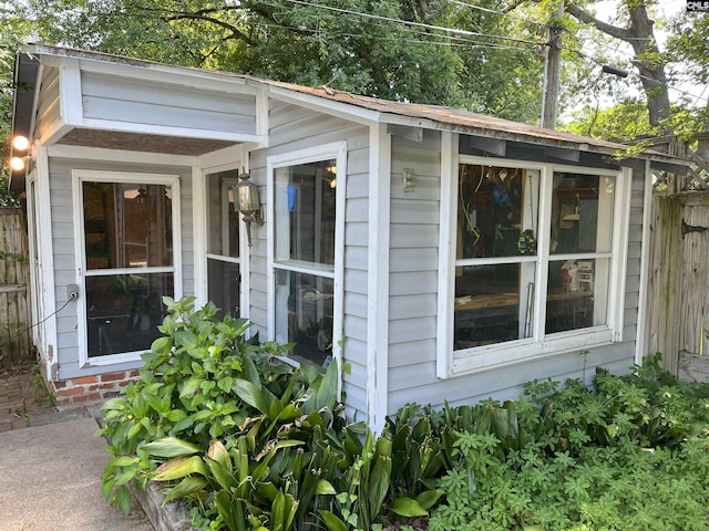 view of home's exterior featuring fence