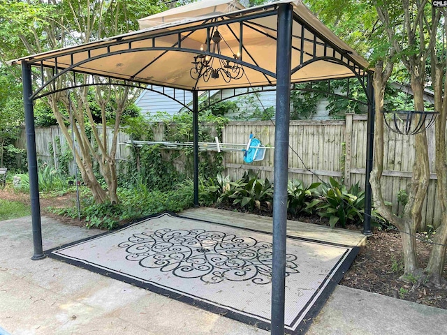 view of patio / terrace featuring fence and a gazebo